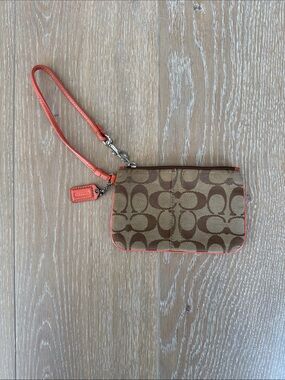 Coach Signature Canvas Wristlet in Brown with Coral Trim